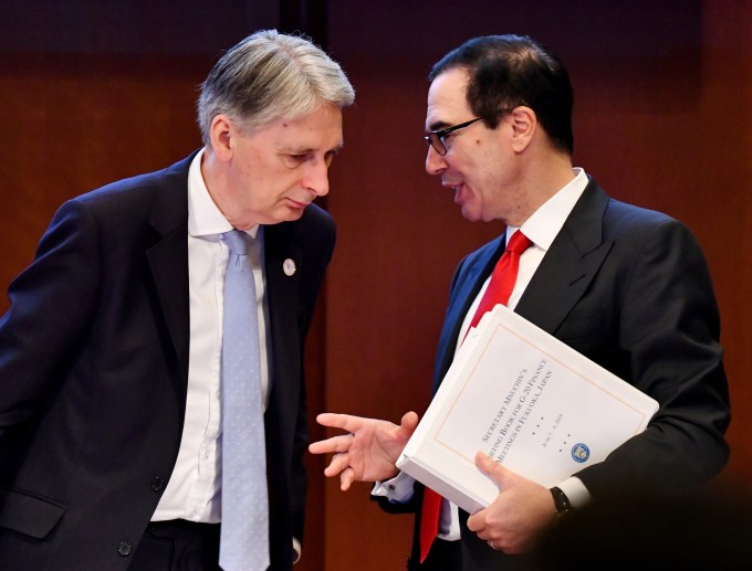 Steven Mnuchin, U.S. Treasury secretary, right, speaks with Philip Hammond, U.K. chancellor of the exchequer, at the 2019 G20 summit