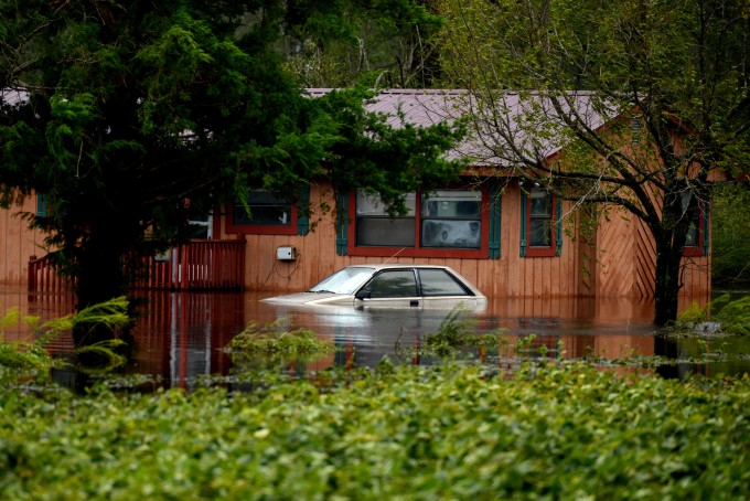 A car stands partially submerged in floodwaters during Tropical Storm Florence near Beulaville, North Carolina.