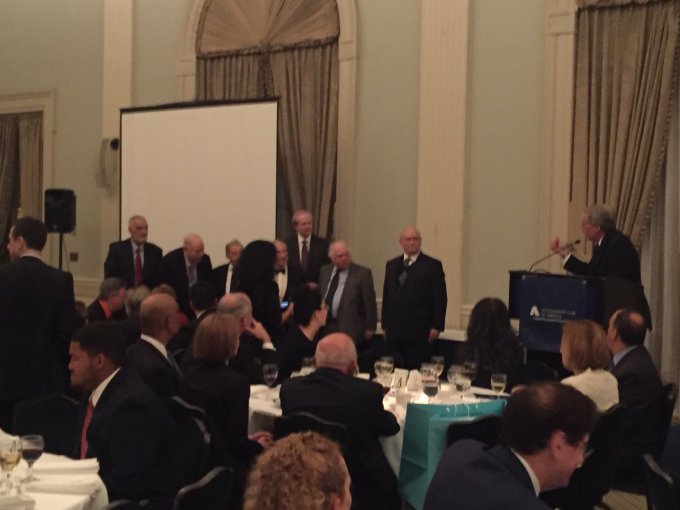 Accountants Club of America president Robert Fligel salutes some of the past presidents of the club