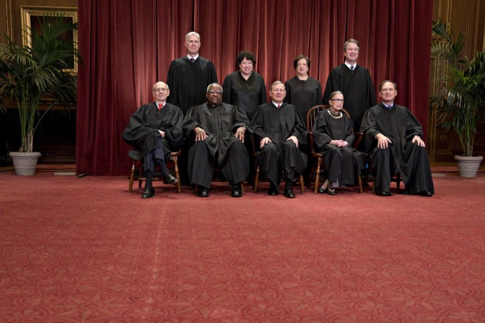 Justices of the U.S. Supreme Court pose during their formal group photograph in the East Conference Room of the Supreme Court in Washington, D.C. Seated from left: Associate Justice Stephen Breyer, Associate Justice Clarence Thomas, Chief Justice John Roberts, Associate Justice Ruth Bader Ginsburg and Associate Justice Samuel Alito Jr. Standing behind from left: Associate Justice Neil Gorsuch, Associate Justice Sonia Sotomayor, Associate Justice Elena Kagan and Associate Justice Brett Kavanaugh.