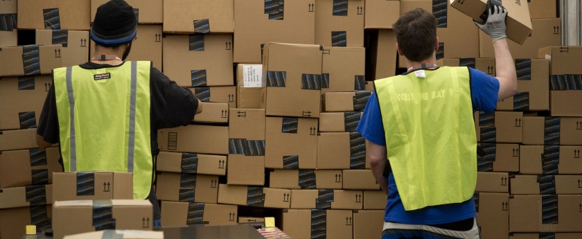 Employees load a truck at the Amazon.com Inc. fulfillment center in Phoenix, Arizona, U.S. on Monday, Dec. 2, 2013. More than 131 million consumers are expected to shop Cyber Monday events, up from 129 million last year, according to the National Retail Federation. Photographer: David Paul Morris/Bloomberg