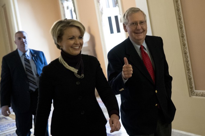 Senate Majority Leader Mitch McConnell, a Republican from Kentucky, gives a thumbs up while walking to the Senate floor at the U.S. Capitol in Washington, D.C., U.S., on Friday, Dec. 1, 2017. 