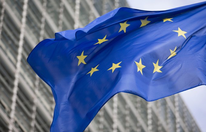 A flag of the European Union flies outside the European Commission building in Brussels, Belgium.