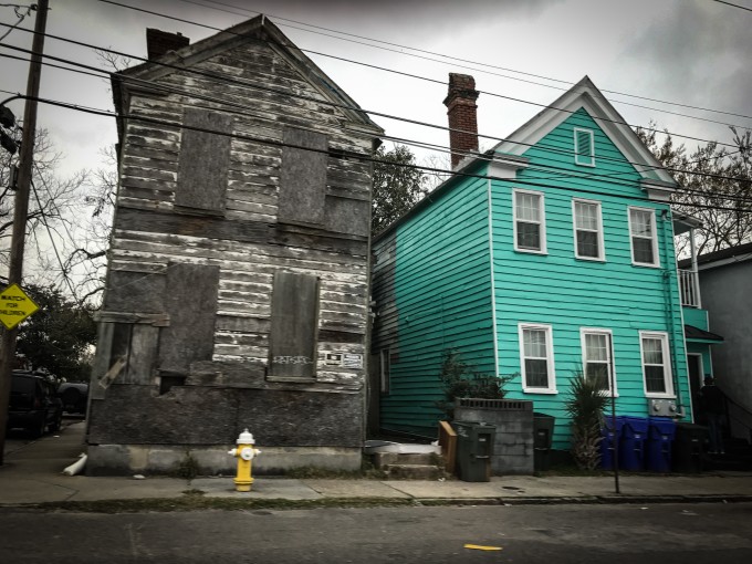 Poor neighborhood, turquoise house, boarded up house