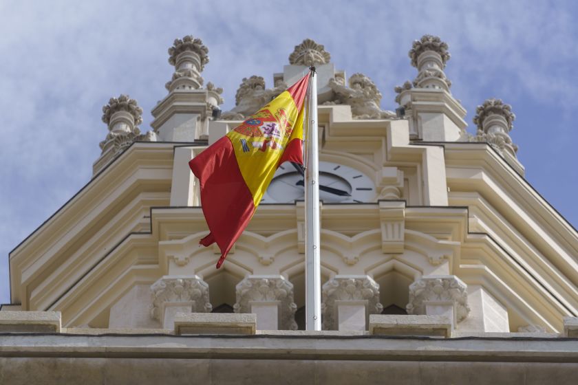 A Spanish national flag flies from the roof of the Spanish central bank in Madrid.